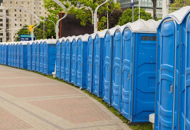 a line of brightly-colored portable restrooms, perfect for outdoor festivals and concerts in Bridgeview, IL